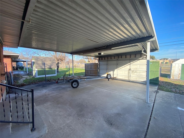 view of patio with a garage and a carport