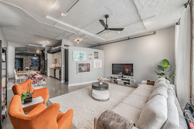 living room with concrete floors and ceiling fan