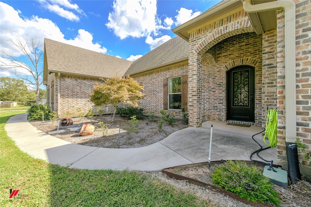 entrance to property featuring a patio area