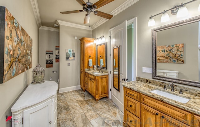 bathroom with ornamental molding, vanity, and ceiling fan