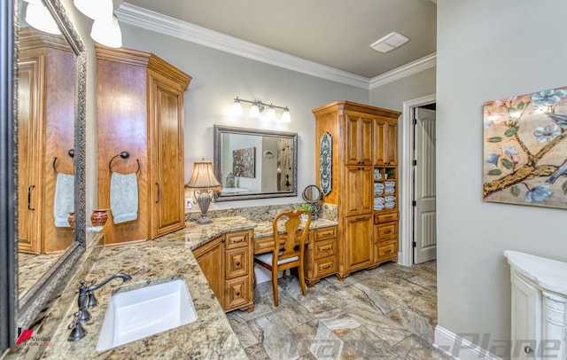 bathroom with crown molding and vanity