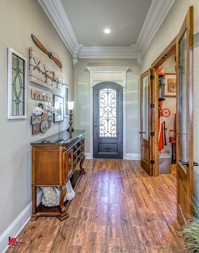 entrance foyer with crown molding, french doors, and dark wood-type flooring