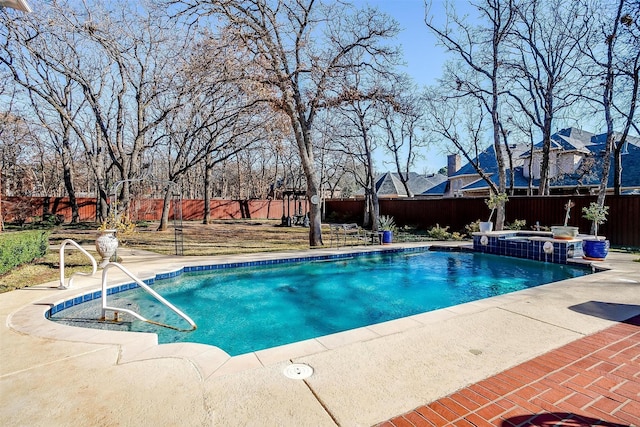 view of swimming pool featuring an in ground hot tub