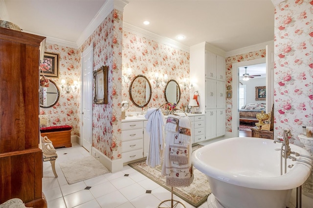 bathroom featuring ceiling fan, a washtub, tile patterned floors, crown molding, and vanity