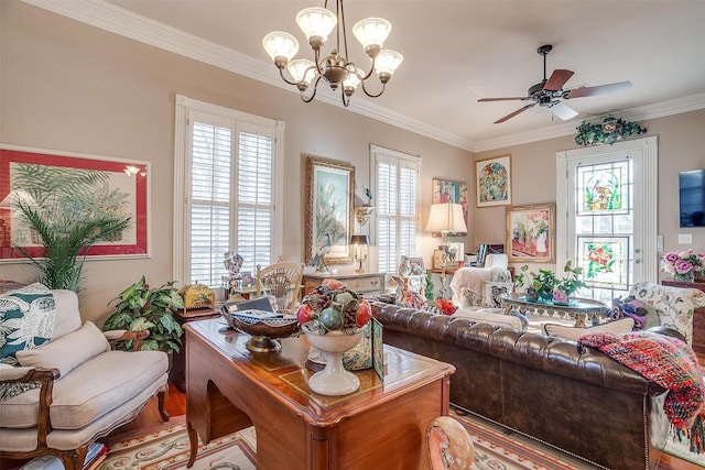 living room with ceiling fan with notable chandelier and crown molding