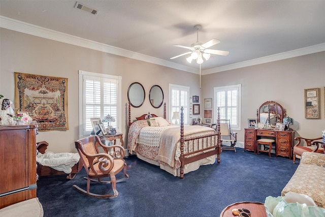 bedroom featuring multiple windows, dark colored carpet, ceiling fan, and ornamental molding