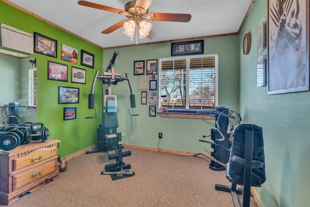 workout room featuring ceiling fan, ornamental molding, a textured ceiling, and carpet flooring