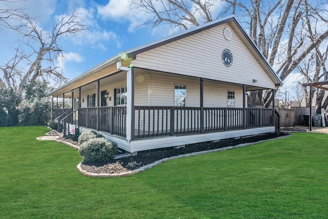 exterior space featuring a porch and a lawn