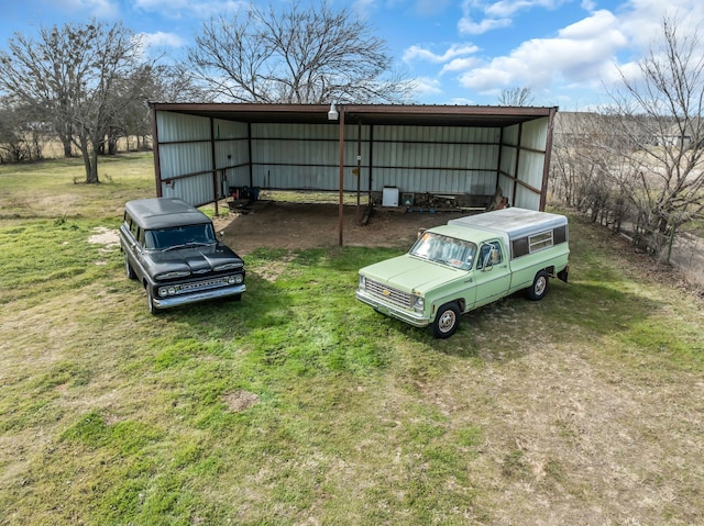 exterior space featuring an outbuilding and a lawn