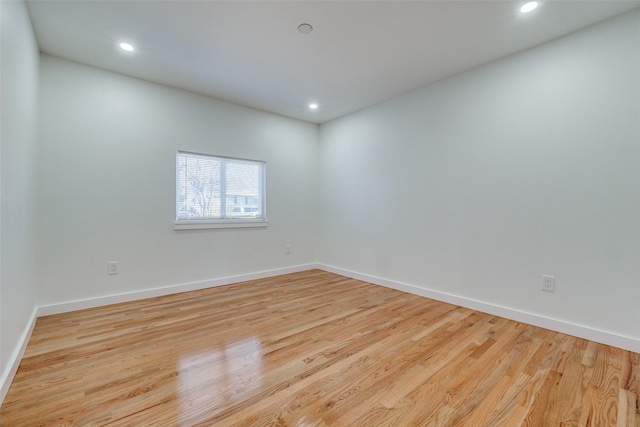 spare room featuring light hardwood / wood-style flooring