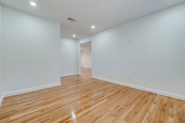 unfurnished room featuring light hardwood / wood-style floors