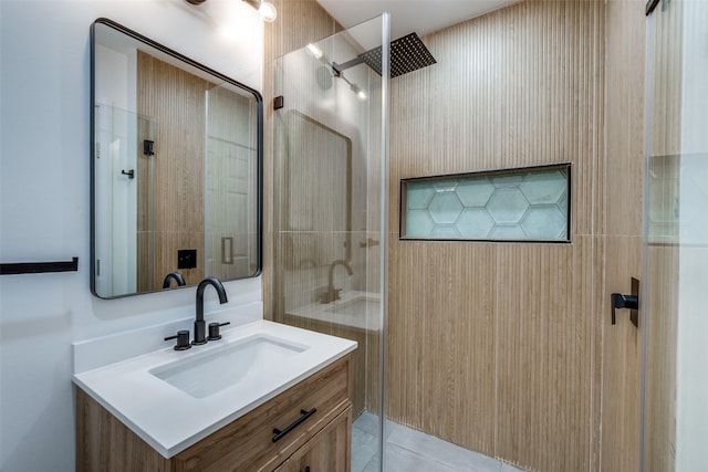 bathroom featuring a shower, tile patterned flooring, and vanity