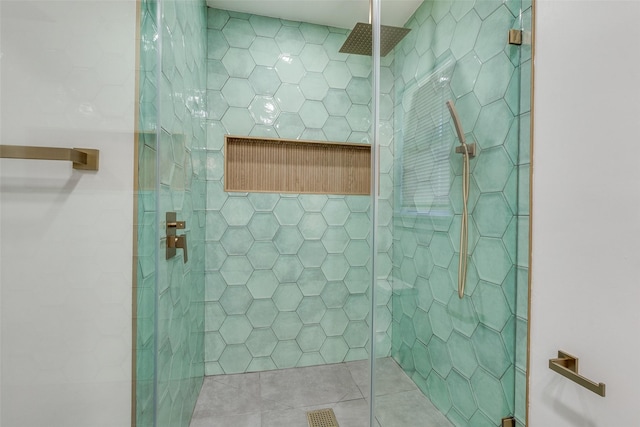 bathroom with tiled shower