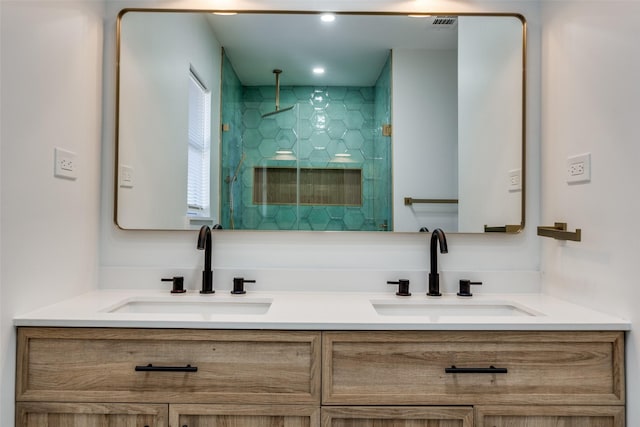 bathroom featuring vanity and a shower with door