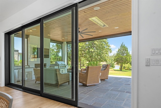 doorway featuring a wealth of natural light and wood ceiling