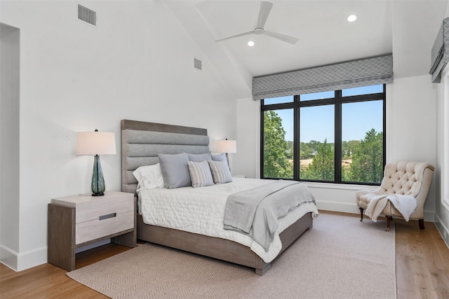 bedroom with light hardwood / wood-style flooring and ceiling fan