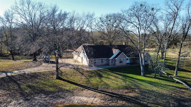 exterior space featuring a garage and a yard