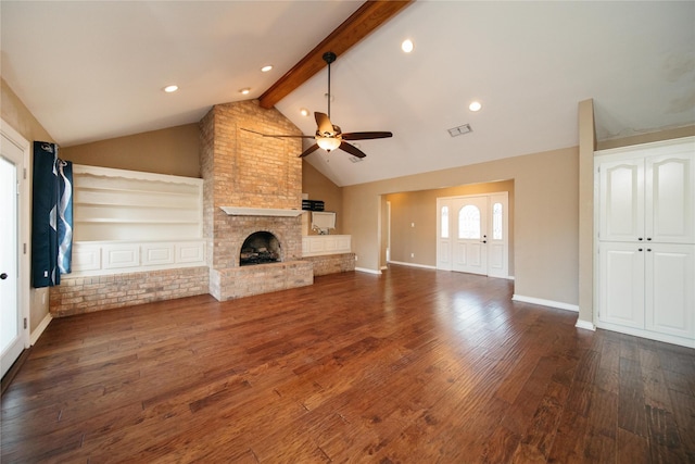 unfurnished living room with dark wood-type flooring, vaulted ceiling with beams, a fireplace, built in features, and ceiling fan