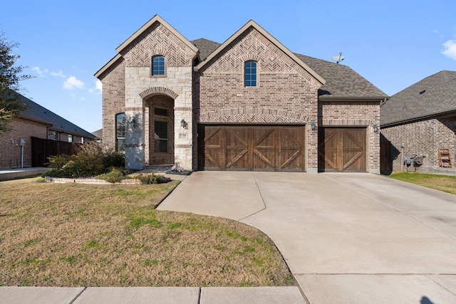 french country inspired facade with a garage and a front yard