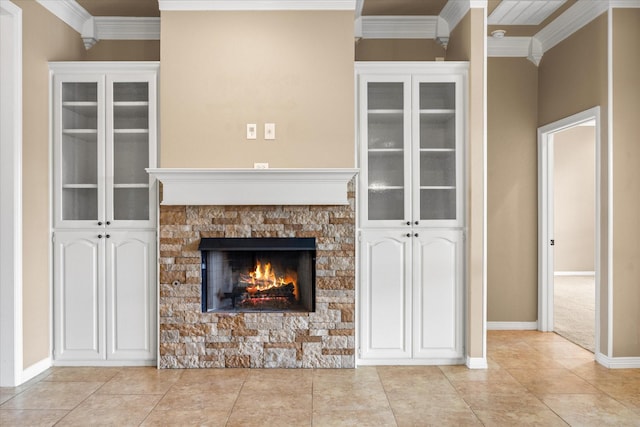 unfurnished living room with light tile patterned flooring, ornamental molding, and a fireplace