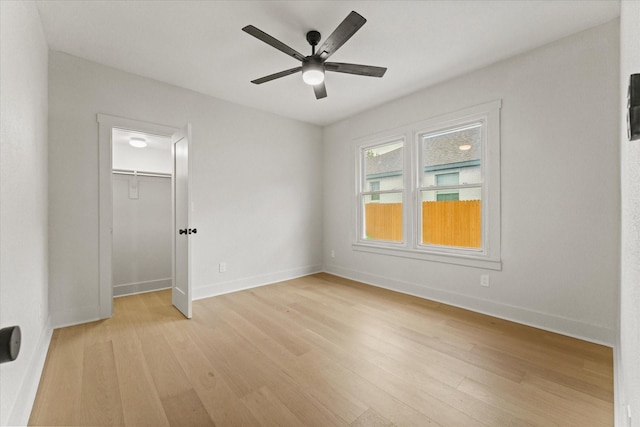 unfurnished room with light hardwood / wood-style floors and ceiling fan