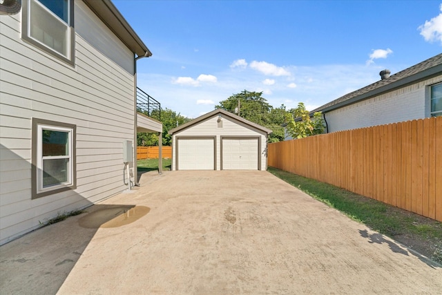 exterior space featuring an outbuilding and a garage