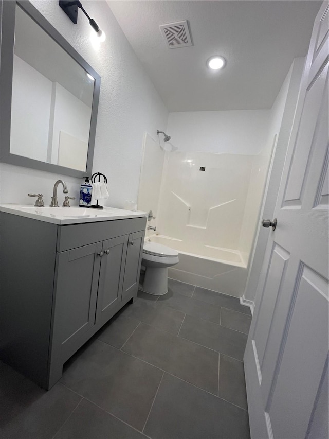 full bathroom with vanity, tile patterned floors, shower / bathtub combination, and toilet