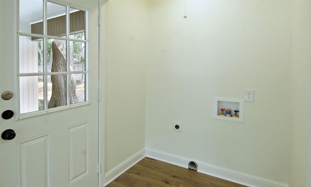 laundry room with washer hookup, dark wood-type flooring, and hookup for an electric dryer