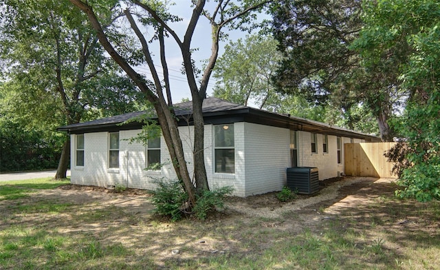 view of side of property with central AC