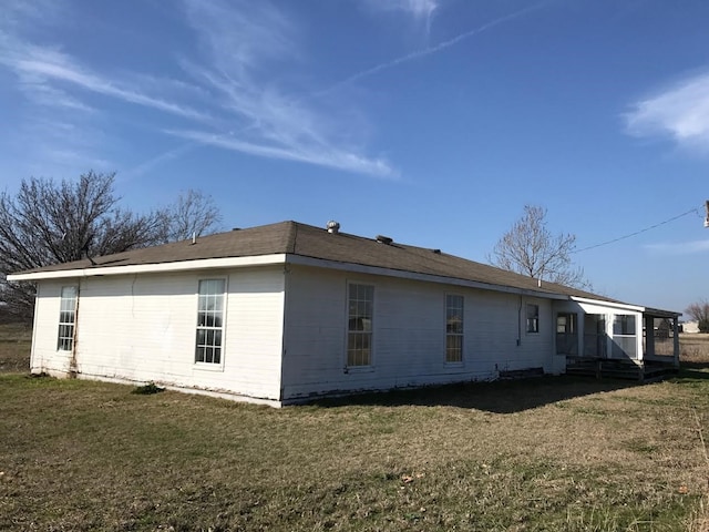 view of home's exterior with a lawn