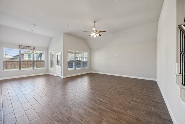 interior space with ceiling fan with notable chandelier and lofted ceiling