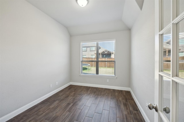 unfurnished room with lofted ceiling