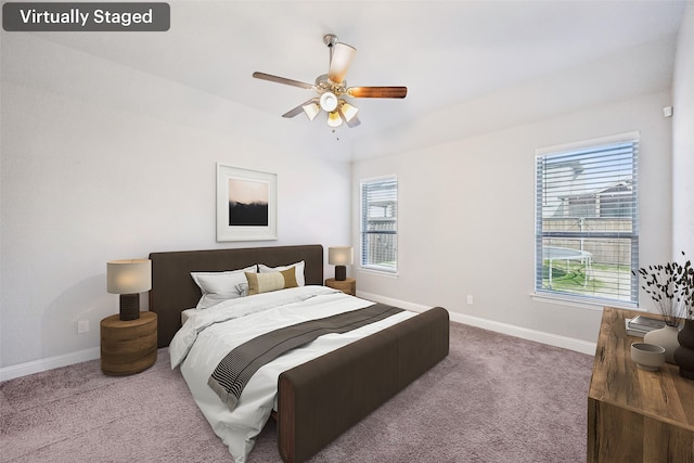 bedroom with ceiling fan and carpet floors