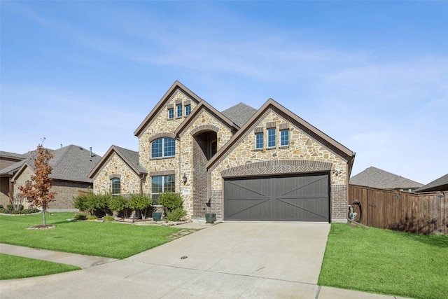 view of front of house with a garage and a front yard