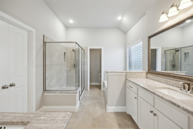 bathroom with plus walk in shower, vanity, vaulted ceiling, and tile patterned flooring