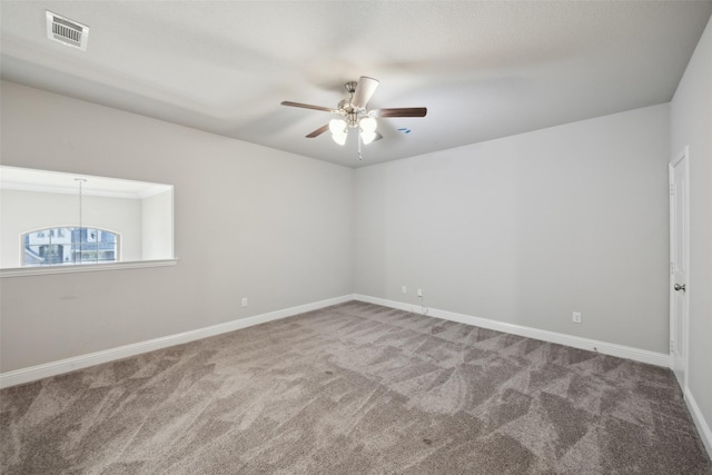 carpeted empty room with ceiling fan