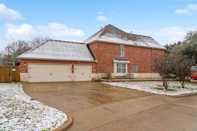 view of side of property featuring a garage