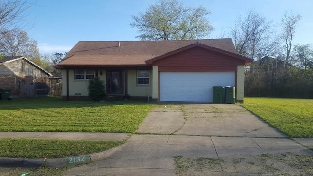 ranch-style home with a garage and a front yard