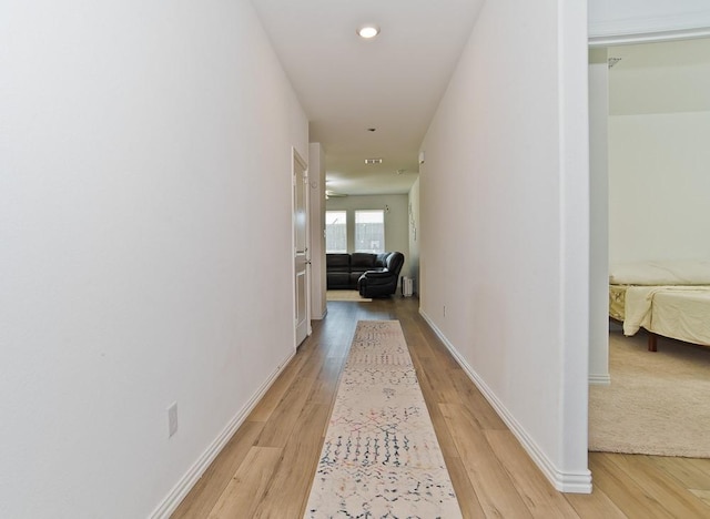 hall with light wood-type flooring