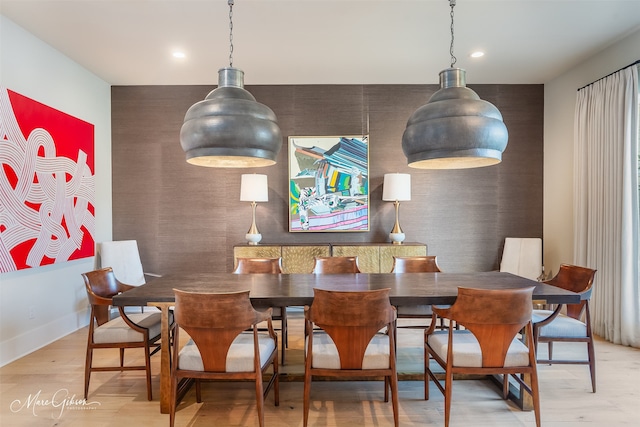 dining area with baseboards, wood finished floors, and recessed lighting