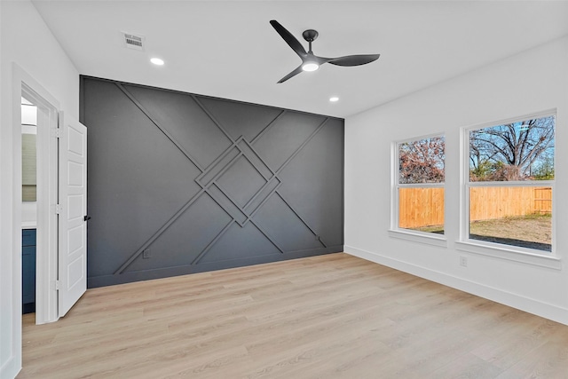 unfurnished room featuring light hardwood / wood-style flooring and ceiling fan