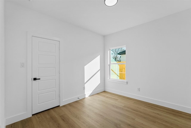 spare room with light wood-type flooring