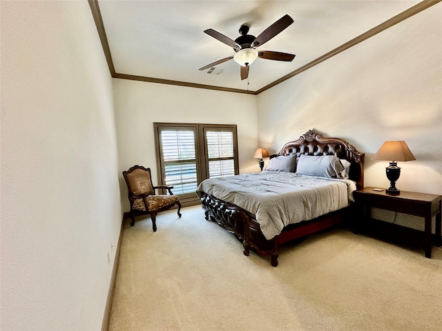 carpeted bedroom with ceiling fan and crown molding