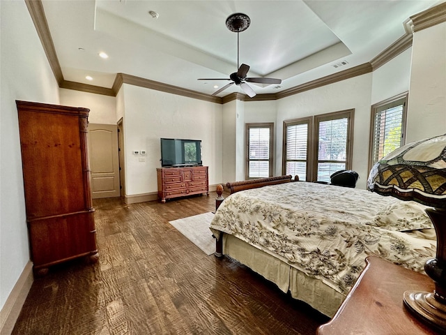 bedroom featuring ceiling fan, dark hardwood / wood-style flooring, and a raised ceiling