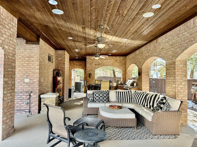 view of patio featuring an outdoor living space, cooling unit, and ceiling fan