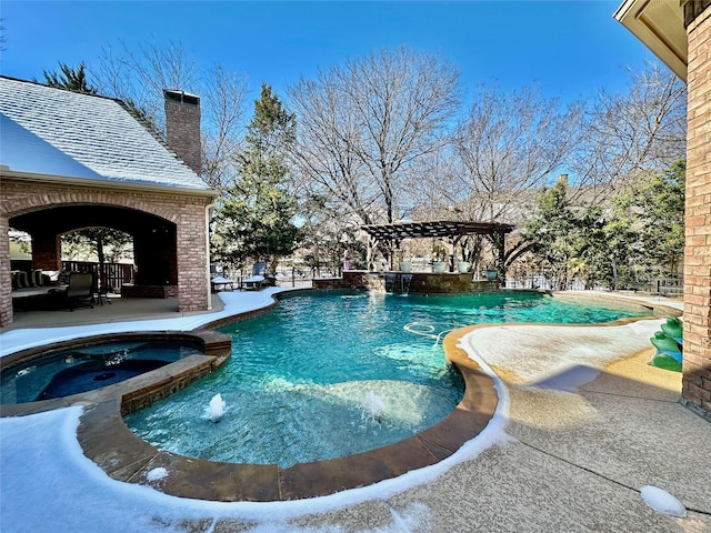 view of pool with an in ground hot tub, a patio area, and a pergola