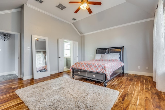 bedroom with ceiling fan, dark hardwood / wood-style flooring, ensuite bathroom, and vaulted ceiling