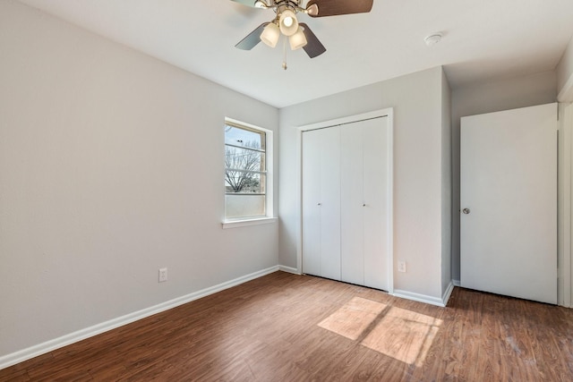 unfurnished bedroom featuring a closet, ceiling fan, and hardwood / wood-style flooring