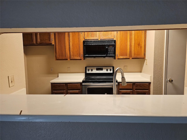 kitchen featuring stainless steel electric range oven