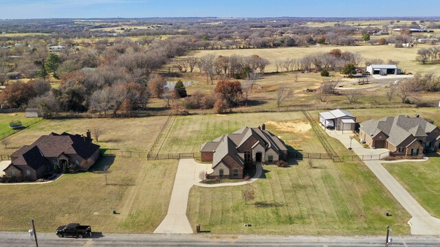 124 Mill Crossing Ln, Springtown, TX 76082 - french provincial home featuring fence, a front lawn, brick siding, and stone siding
